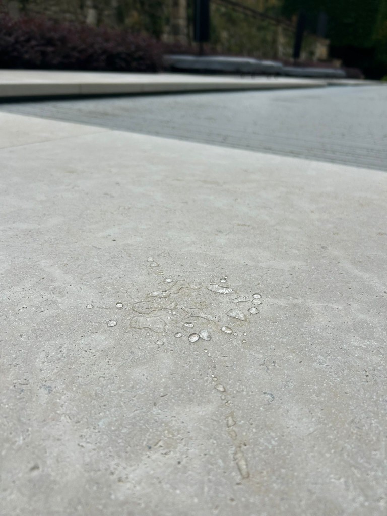 Water droplets beading on freshly sealed limestone in Melbourne by Claraseal