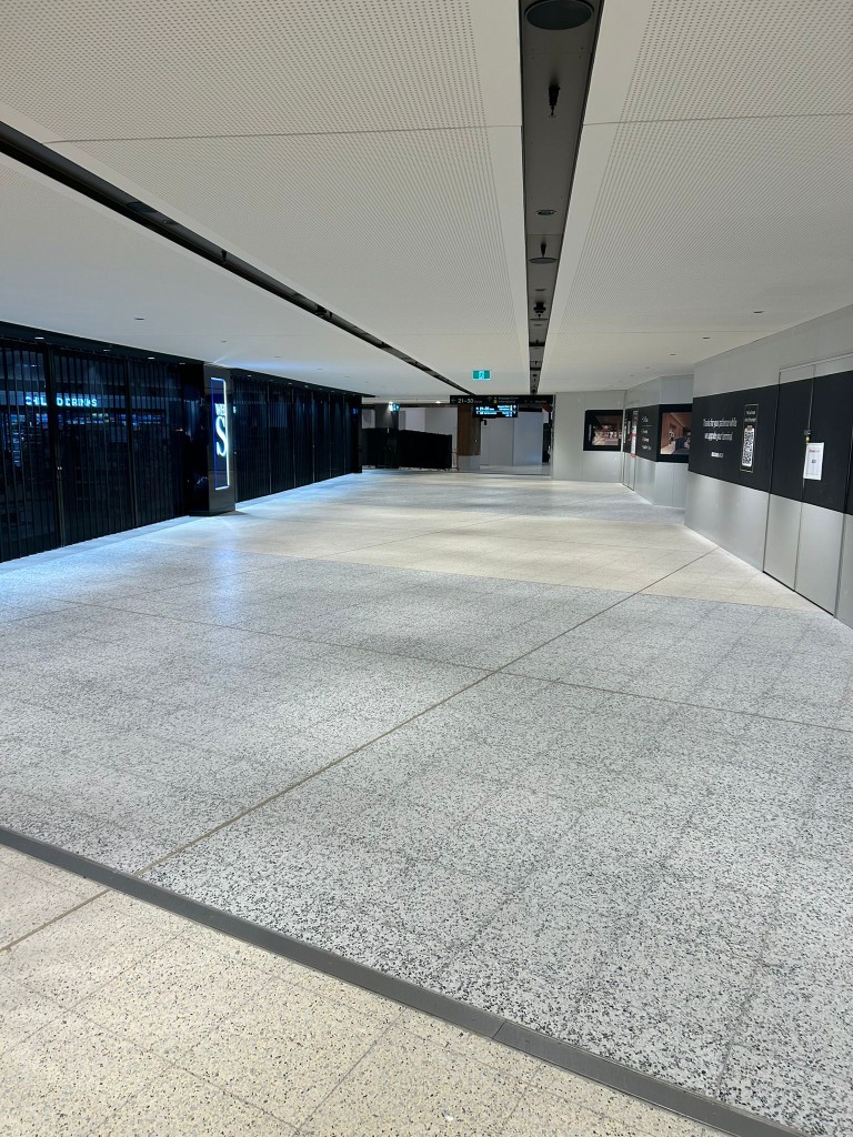 Mirror-polished granite tile floor in a Melbourne commercial mall by Claraseal