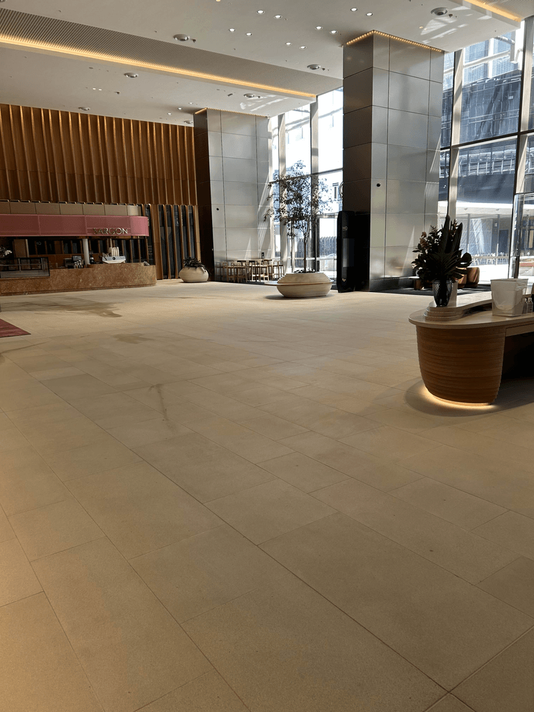 Sealed sandstone tile floor in modern Melbourne commercial high-rise lobby