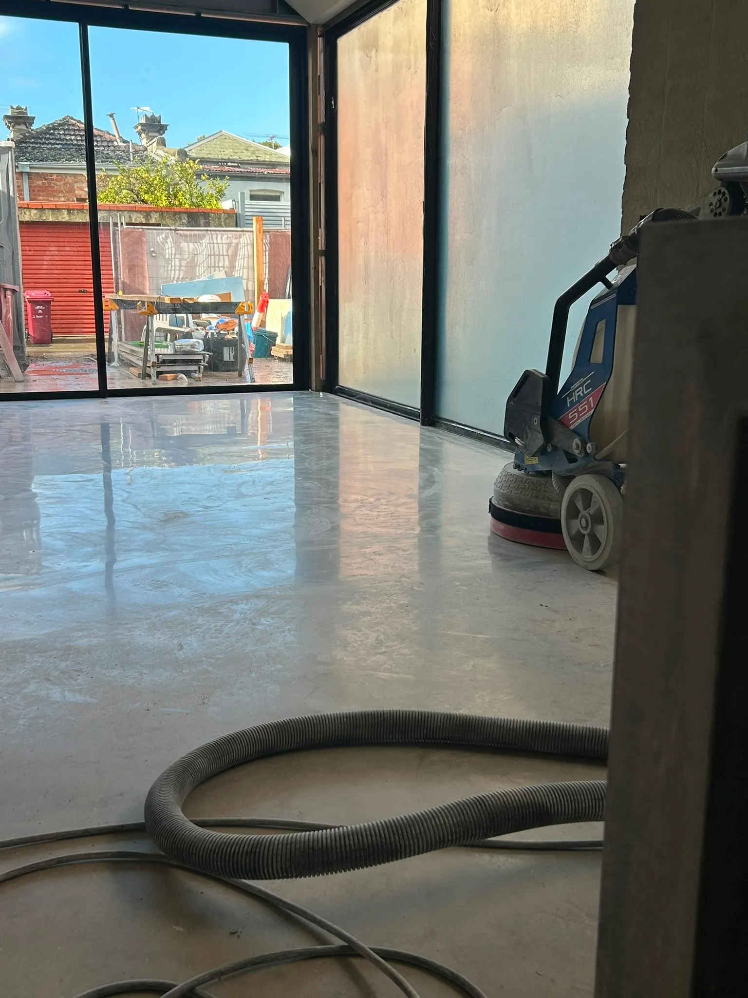 HRC grinder on polished concrete surface during residential renovation, Claraseal Melbourne