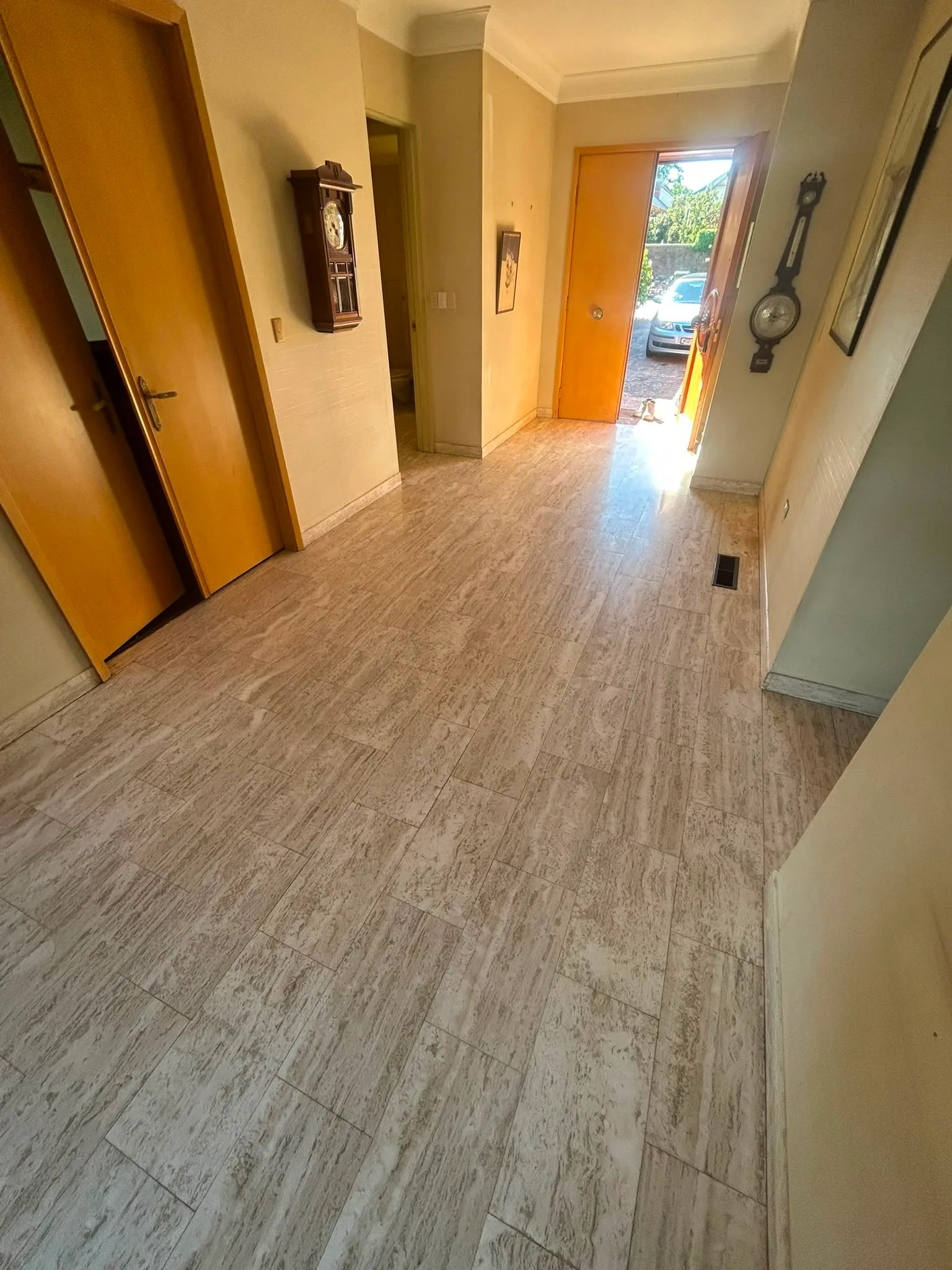Honed stone tile hallway floor in established Melbourne residential home, sealing and restoration by Claraseal