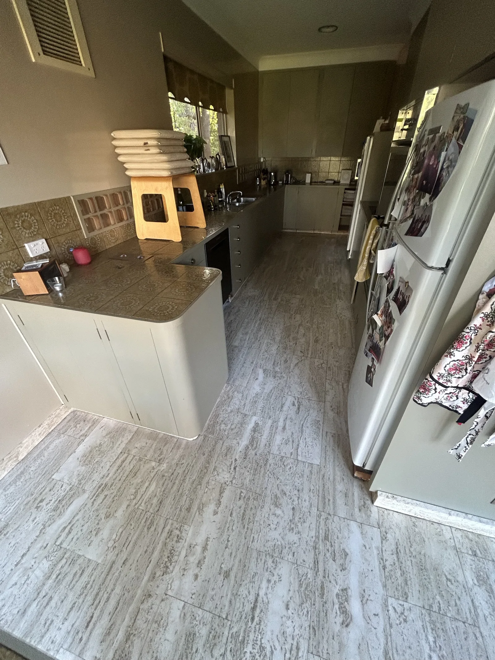 Travertine tile floor through a galley kitchen in an established Melbourne home